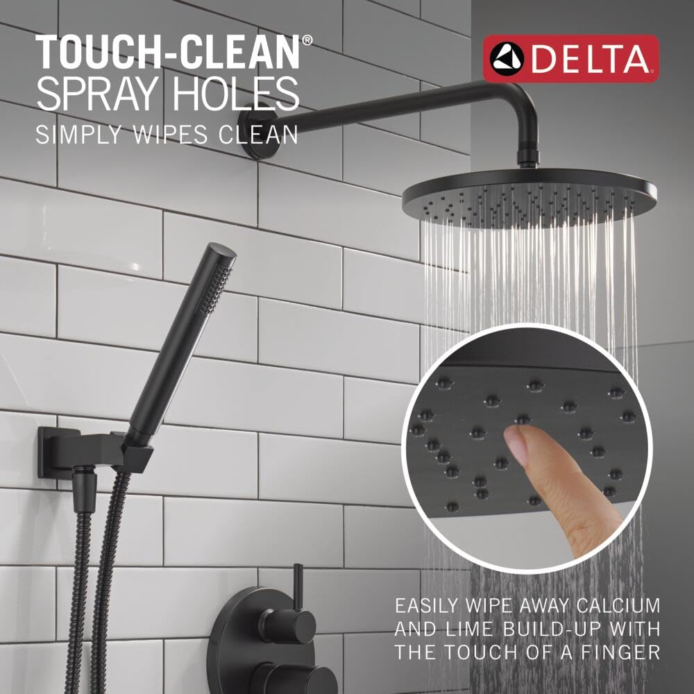 Matte black shower system with large raincan showerhead, handheld shower wand, and wall-mounted valve control on subway tile 