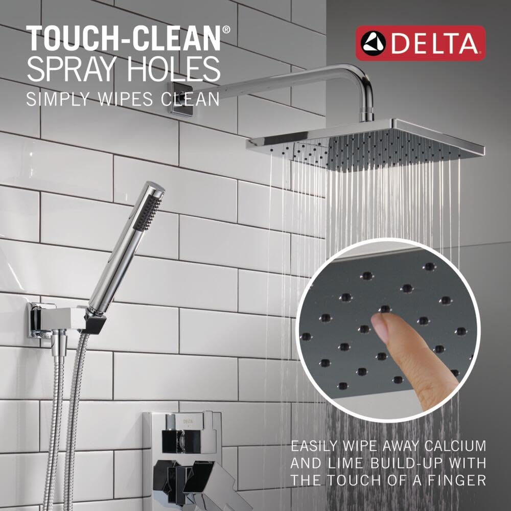 Chrome shower system with square raincan head, handheld shower wand, and curved arm mounted on white subway tile wall.