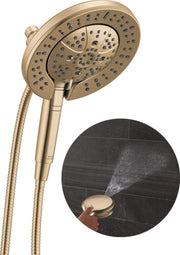Champagne bronze showerhead with multiple spray jets and attached hose, detail view shows spray pattern.