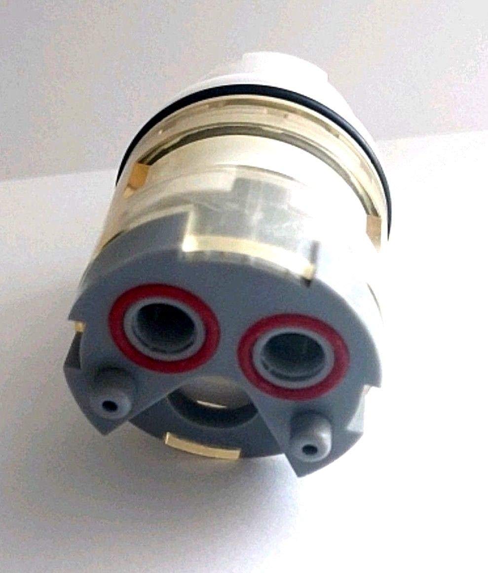 Ceramic cartridge with gray body, two red inlet ports, white cap, and metal collar components.