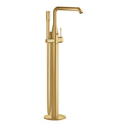 Brushed gold freestanding tub faucet with curved spout, single handle, and handheld shower wand attached to vertical stand.