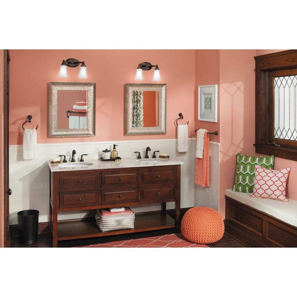 Oil rubbed bronze 24-inch towel bar mounted on bathroom wall above sink vanity.