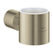 Brushed nickel cylindrical holder with white ceramic cup interior and wall-mounted bracket for bathroom accessories.