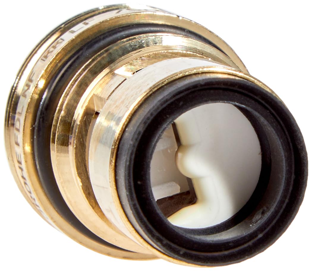 Grohe ceramic cartridge with stacked brass and black rubber rings and white ceramic disc center component.