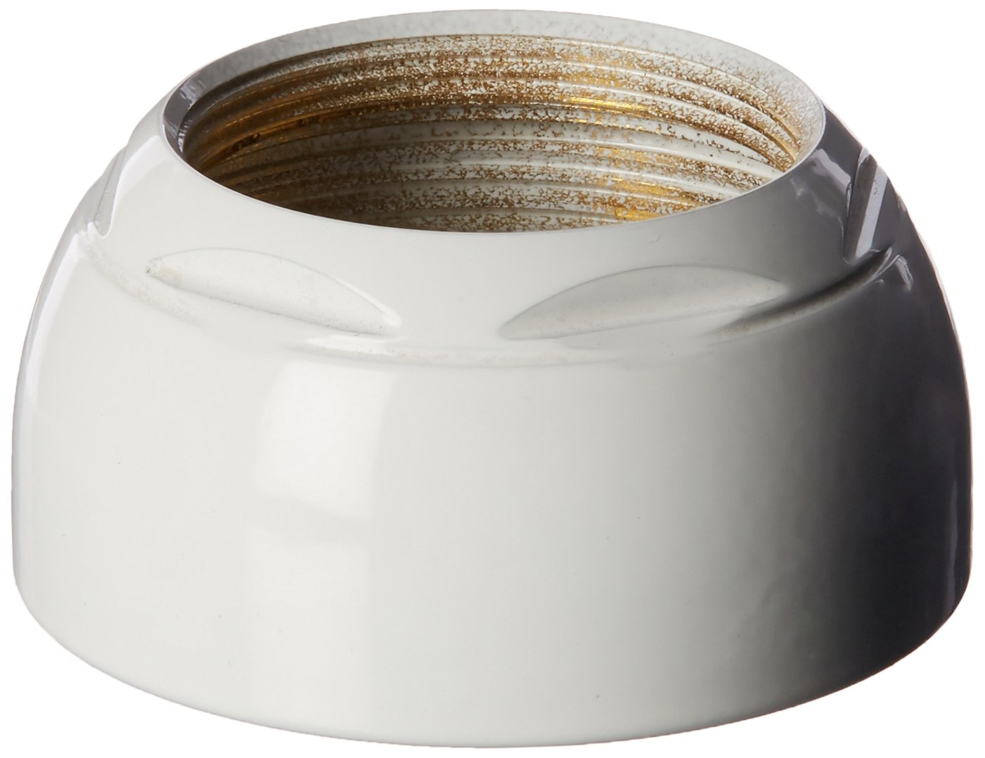 White bonnet nut with threaded brass interior, dome-shaped design for faucet assembly.