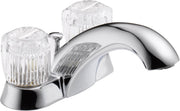 Chrome bathroom faucet with two clear ribbed handles and curved spout for centerset sink installation.