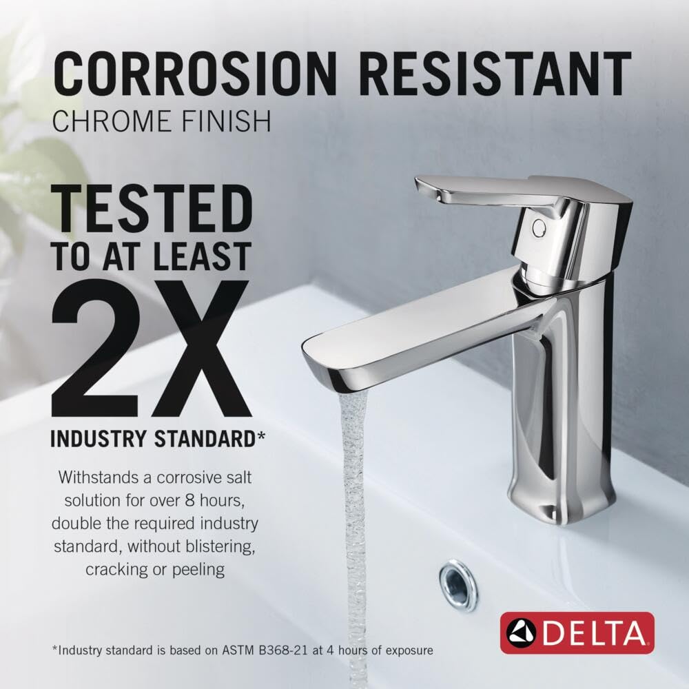 Chrome single-handle bathroom faucet with curved spout dispensing water over white sink basin.