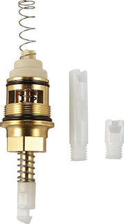 Chrome and brass diverter cartridge with coiled spring, cream plastic components, and two white plastic adapter pieces.