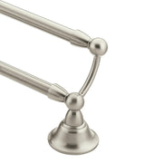 Brushed nickel double towel bar with two parallel horizontal bars and spherical end caps mounted on a pedestal base.