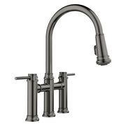 Satin dark steel bridge faucet with pull-down sprayer head and two side handles.