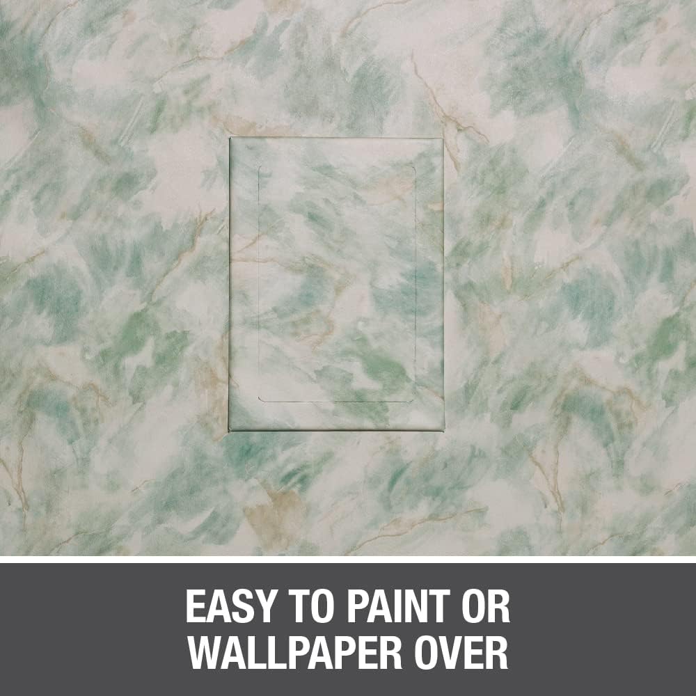 White rectangular access panel mounted on marbled green and white wall surface.