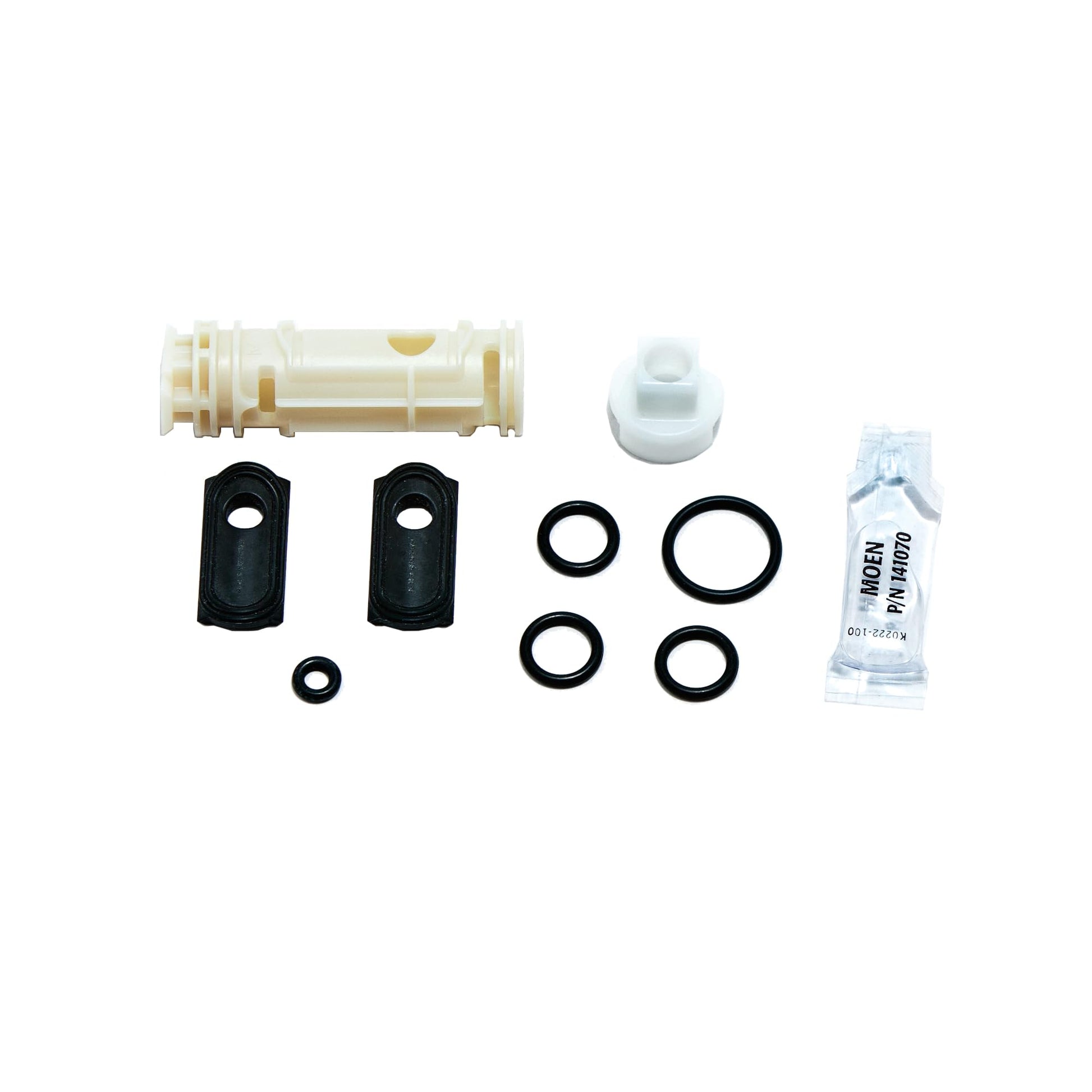 Moen Posi-Temp cartridge repair kit containing plastic cartridge, black seals, white cap, rubber rings, and lubricant packet.