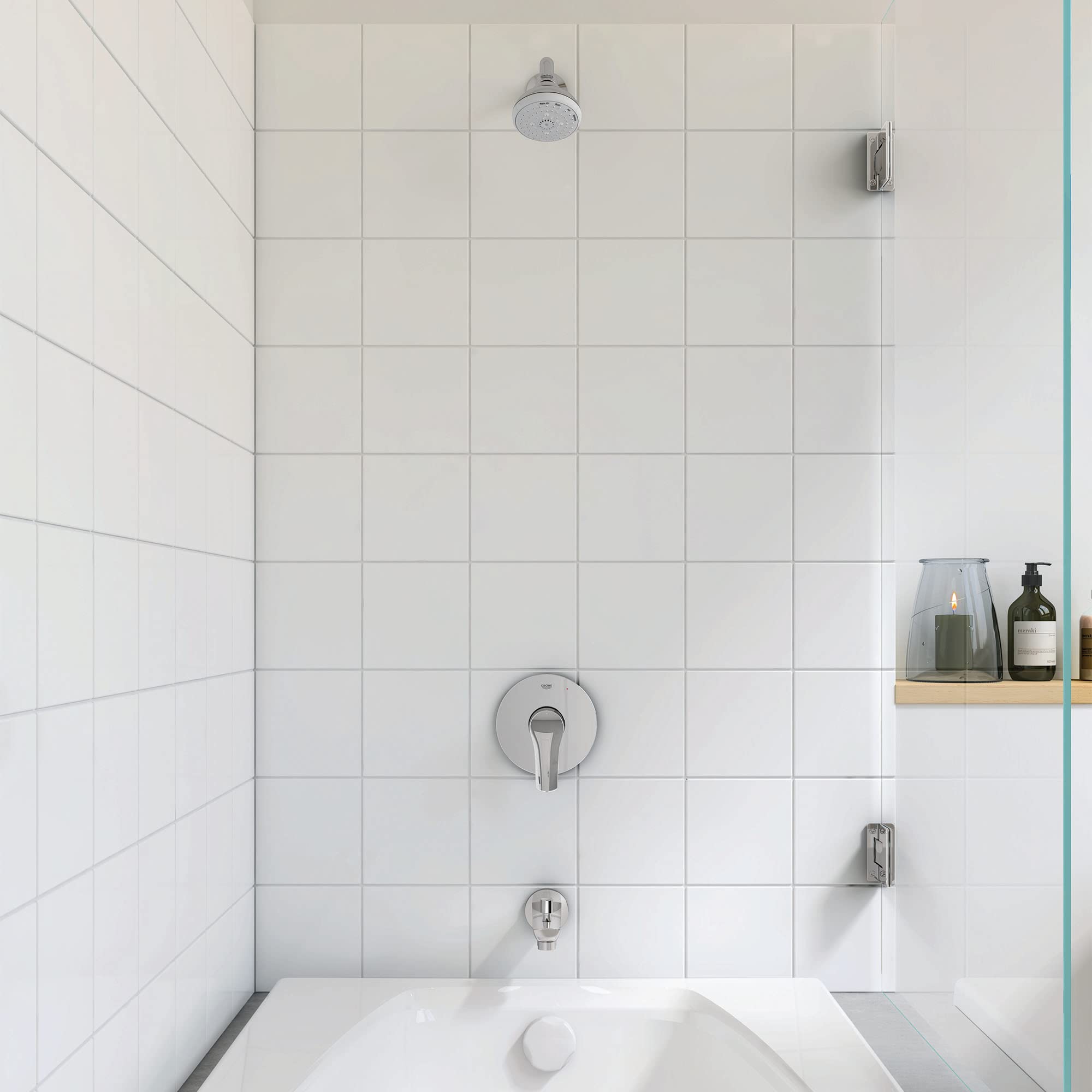 Chrome pressure balance valve trim with single lever handle and showerhead mounted on white subway tile shower wall.