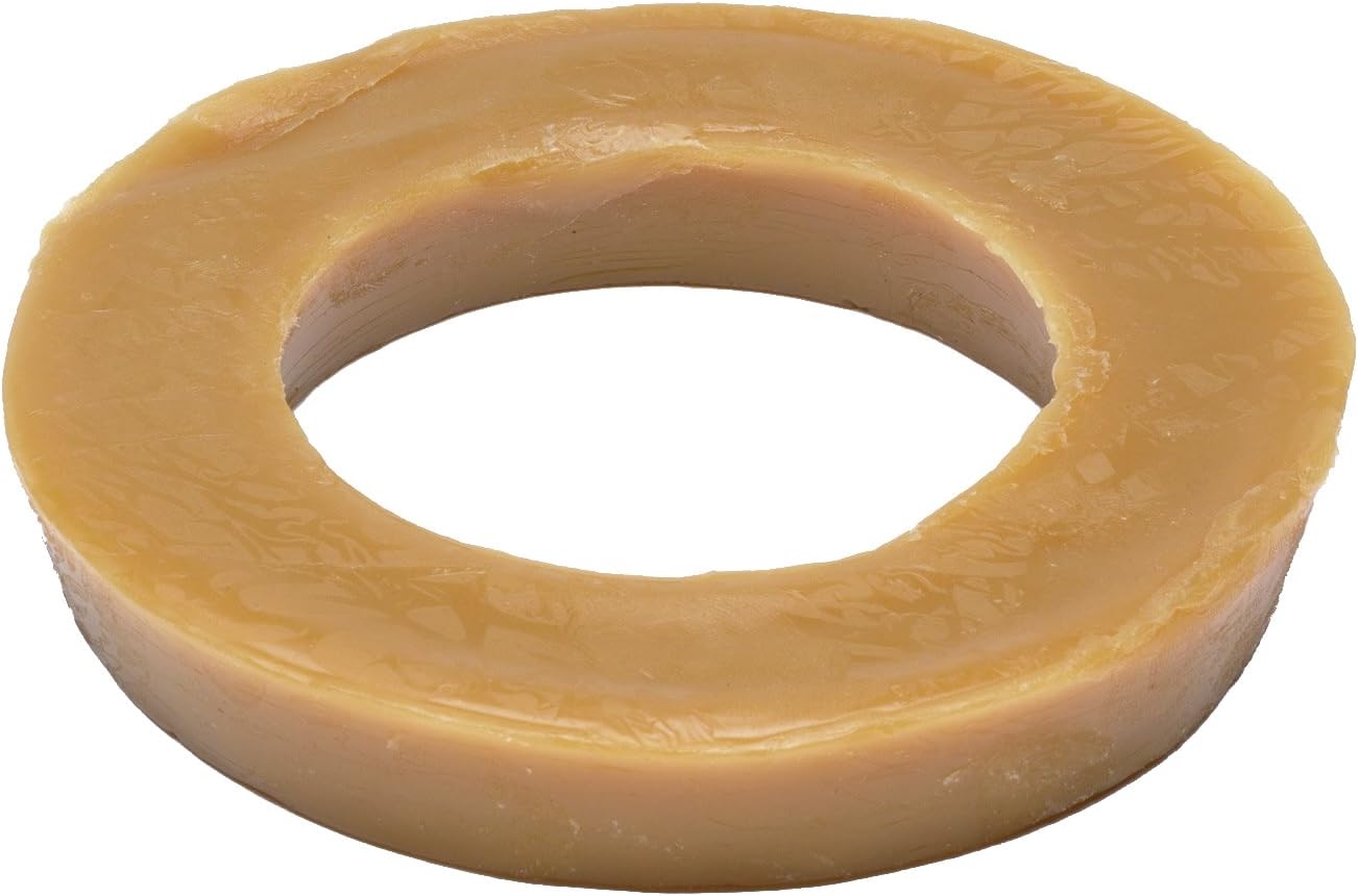 Tan wax bowl ring with oval center opening, viewed from above at an angle.