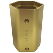 Brass-colored bonnet nut tool with hexagonal opening, Delta branding, and two circular holes on the cylindrical body.