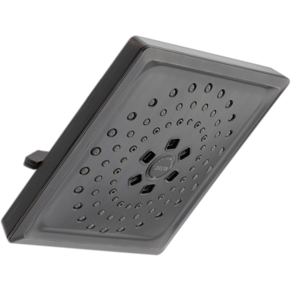 Square matte black shower head with multiple spray holes and three setting buttons in the center.