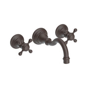 Oil-rubbed bronze wall-mount bathroom faucet with curved spout and cross handles.
