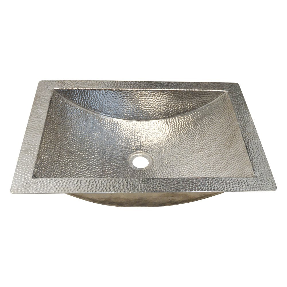Polished nickel undermount sink with hammered texture and curved basin design.