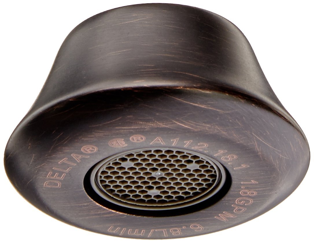 Venetian bronze faucet aerator with perforated screen insert and embossed Delta product markings on base.