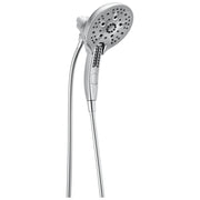 Chrome two-in-one showerhead with handheld spray attachment and flexible hose against white background.