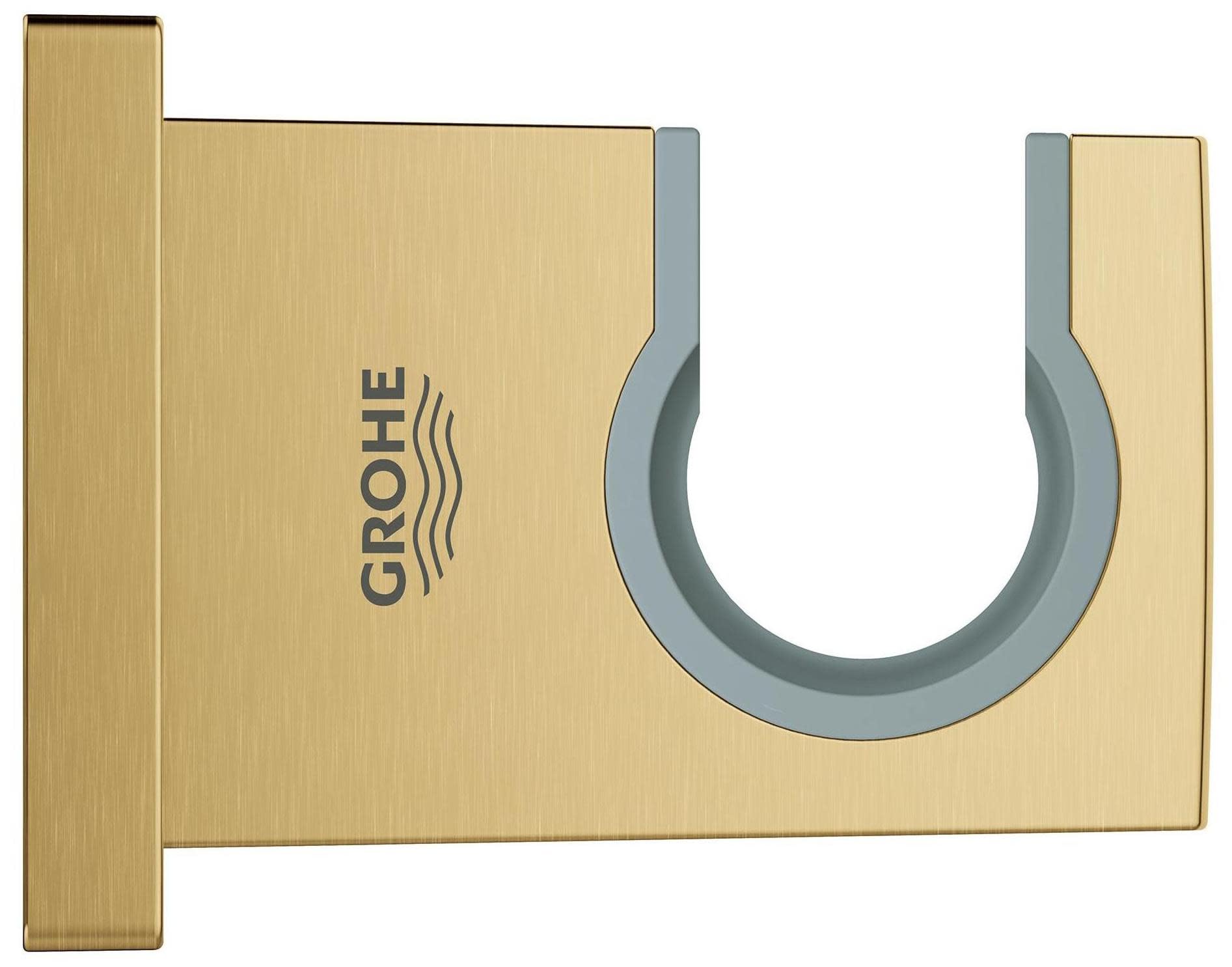 Matte black and brushed gold wall-mounted hand shower holder with circular grip and Grohe logo.