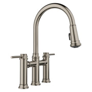 Satin platinum bridge faucet with high curved spout, pull-down spray head, and dual lever handles.