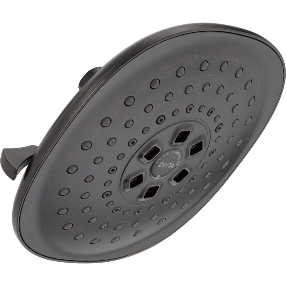 Matte black raincan shower head with multiple spray holes and central setting dial, includes mounting arm.
