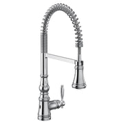 Chrome kitchen faucet with coiled pulldown sprayer hose and single lever handle.