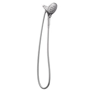 Chrome handheld showerhead with perforated face and flexible hose attached to wall mount.