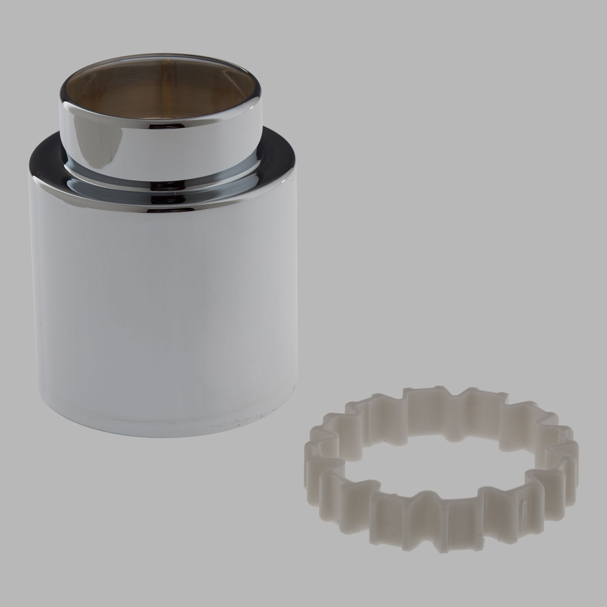 Chrome trim sleeve with nested spacer ring and translucent plastic spacer component displayed separately.