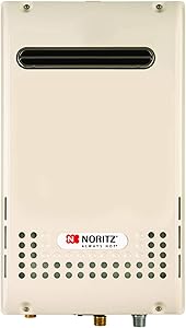 Cream-colored outdoor tankless water heater with black slot vent and perforated bottom panel with Noritz branding.