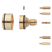 Brass Grohe Grohtemp extension kit components including cylindrical sleeves with black seals, threaded cartridge, and various