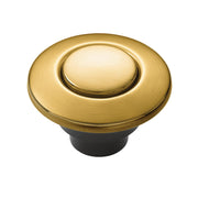 Brushed gold circular air switch button with domed center and black base for garbage disposal control.