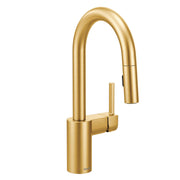 Brushed gold pulldown bar faucet with single handle lever and curved spout against white background.