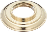 Polished brass handle base with concentric grooves and central opening for gasket installation.