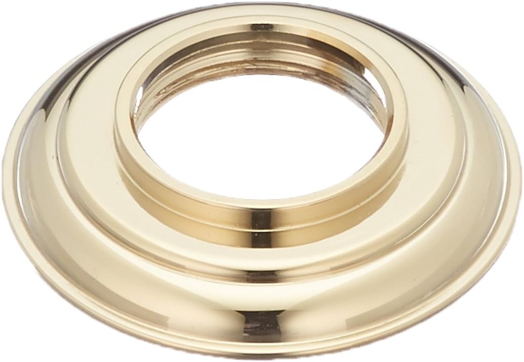 Polished brass handle base with concentric grooves and central opening for gasket installation.