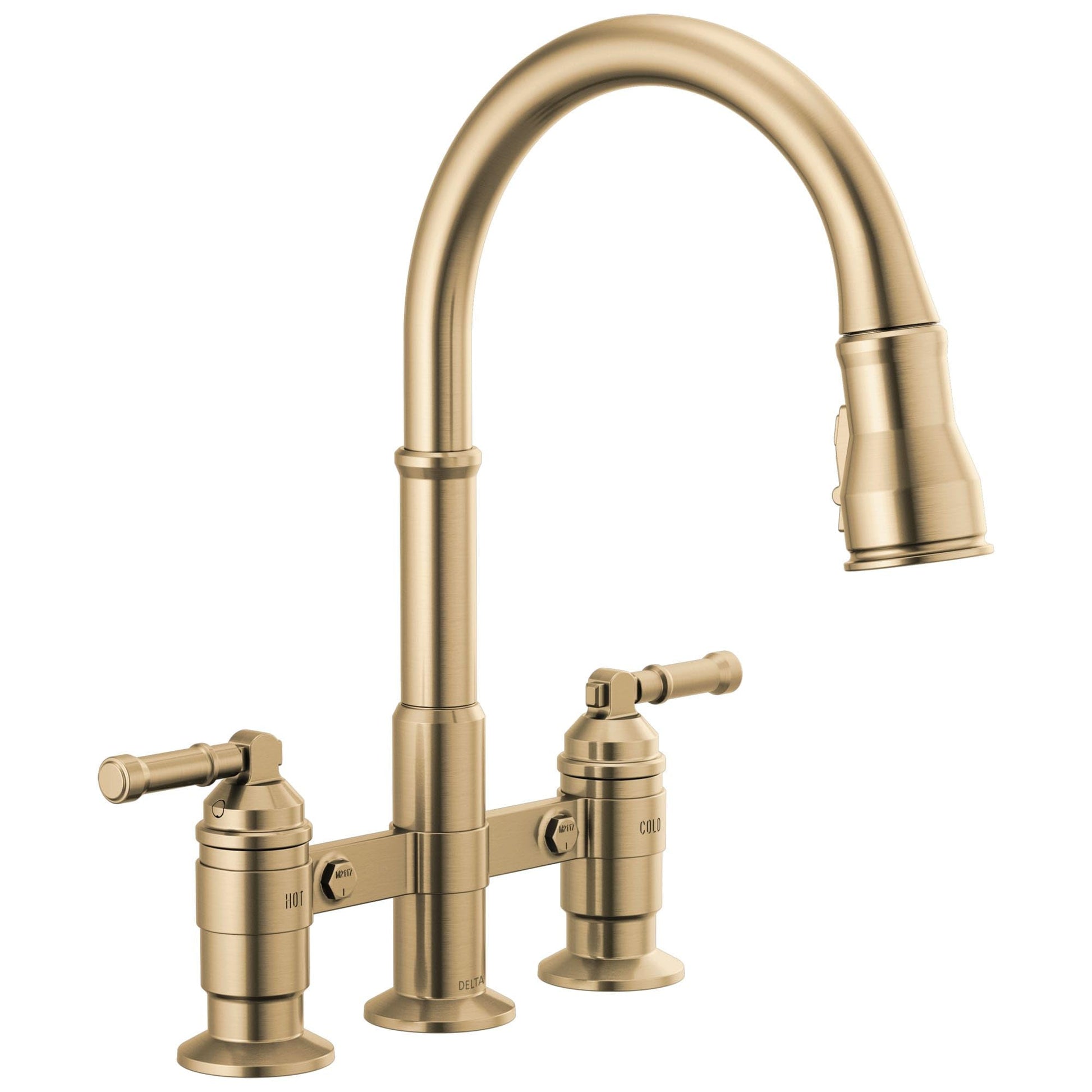 Champagne bronze bridge kitchen faucet with arched pull-down spout and two lever handles on each side.