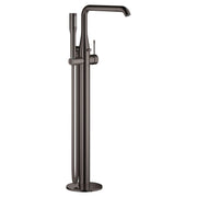 Dark graphite freestanding tub faucet with single handle, curved spout, and detachable hand shower on hose.