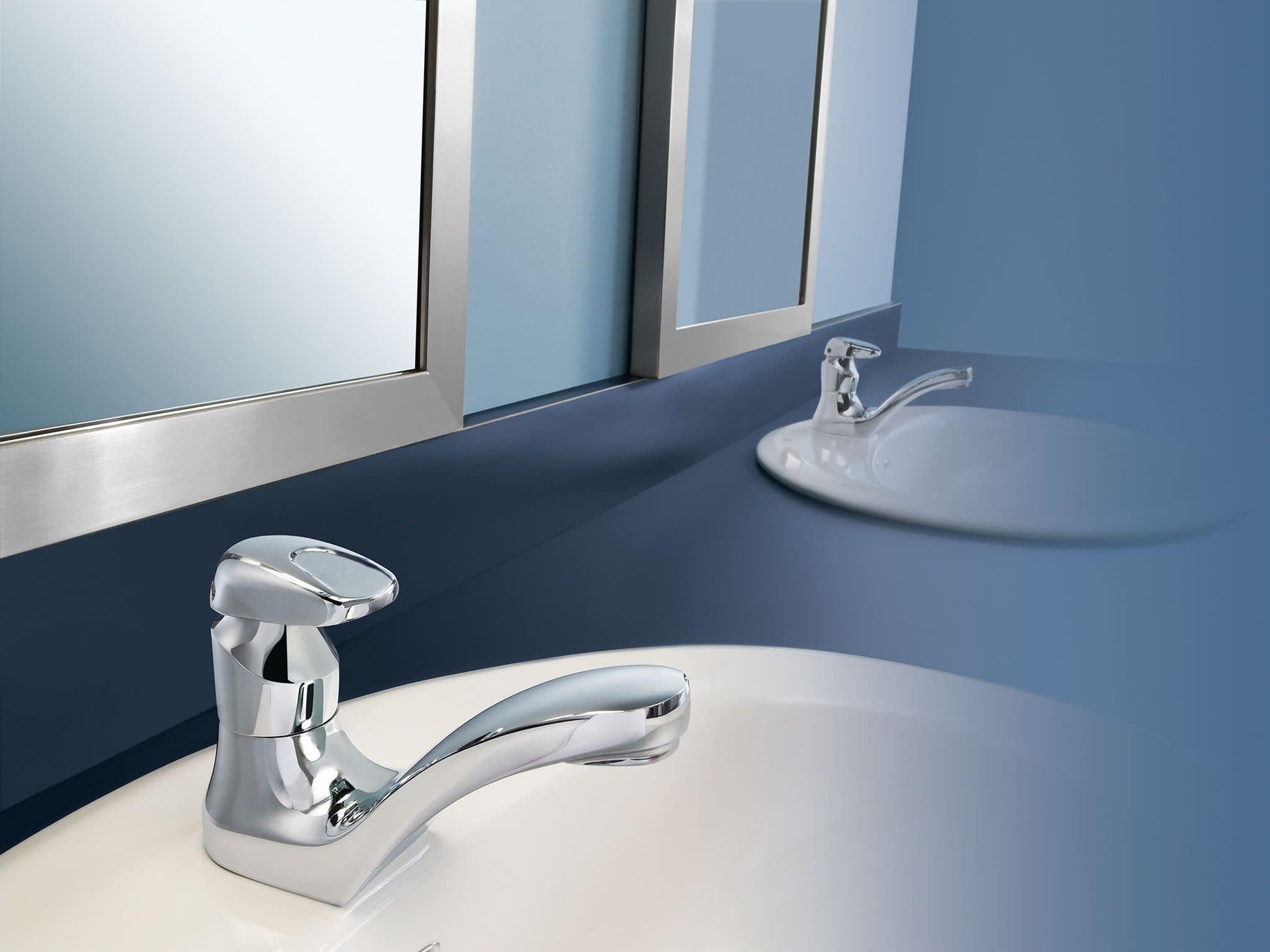 Chrome single-handle bathroom faucet with curved spout mounted on white sink in blue bathroom with mirror.