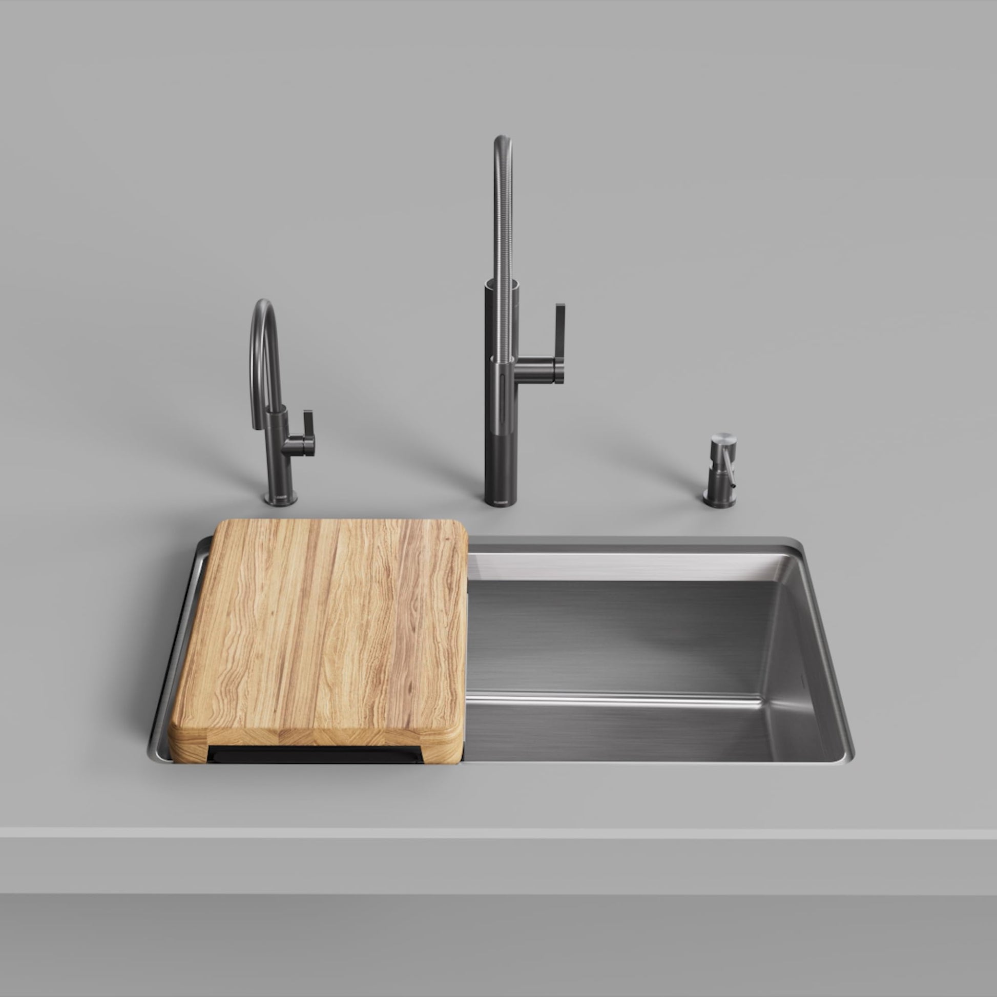 Stainless steel rectangular kitchen sink with wooden cutting board, tall faucet, and soap dispenser displayed on countertop.