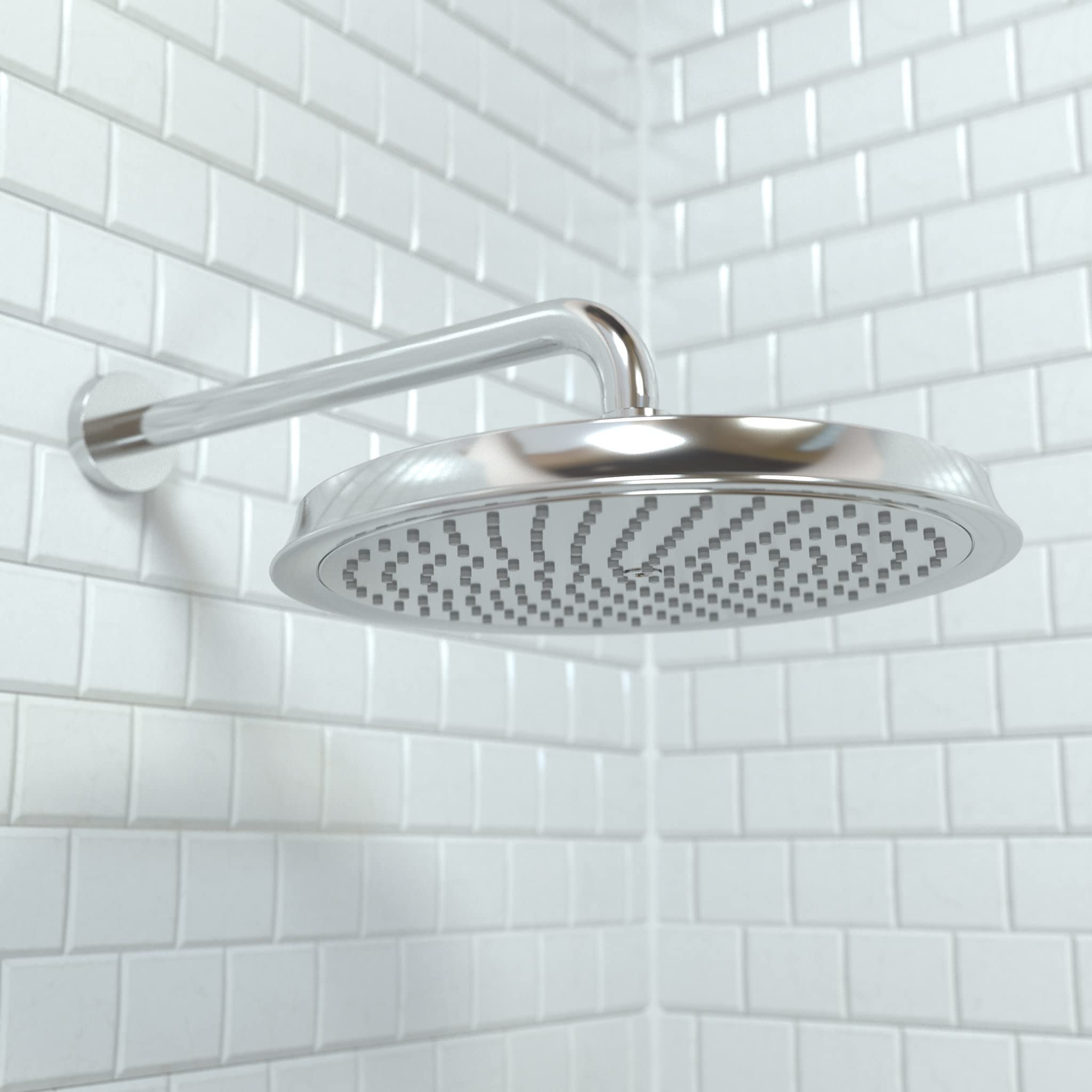 Chrome overhead shower head with circular spray face and curved arm mounted on white subway tile wall.