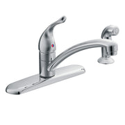 Chrome single-handle kitchen faucet with curved spout, pull-out spray head, and matching soap dispenser.