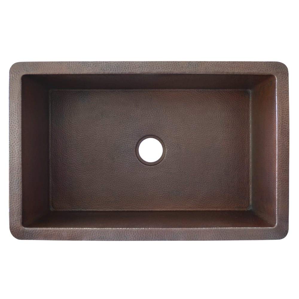 Antique copper rectangular undermount kitchen sink with hammered finish exterior and single drain hole.
