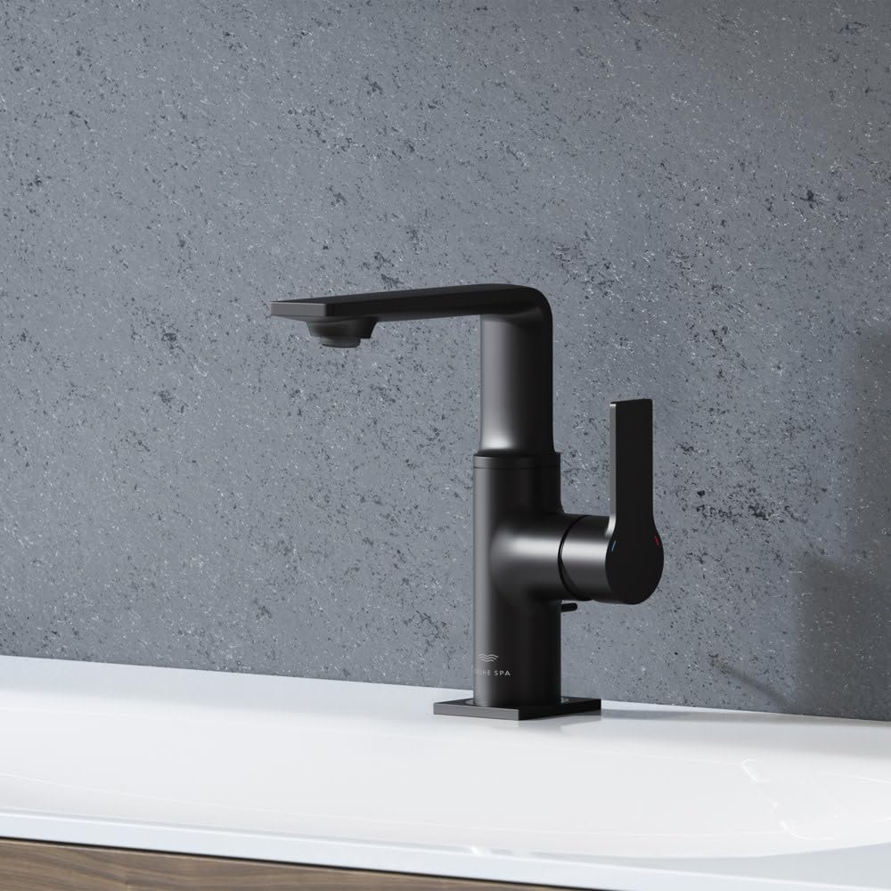 Chrome single-handle bathroom faucet with angled spout and lever handle on white sink basin.