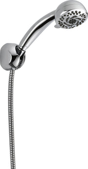Chrome hand shower head with multiple spray holes, curved arm, wall mount bracket, and flexible hose connection.