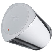 Chrome faucet handle with circular top plate featuring Grohe logo and red indicator dot.