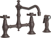 English bronze bridge kitchen faucet with dual cross handles, curved spout, and matching side spray attachment.