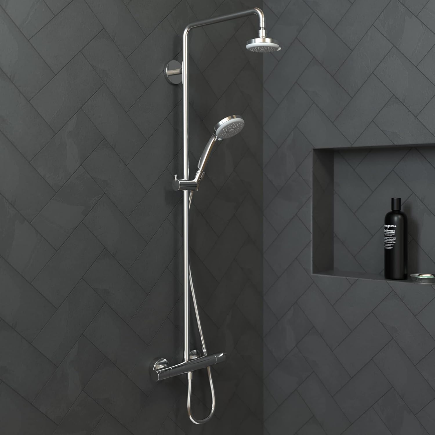 Chrome shower system with overhead rainfall head, hand shower, and thermostatic valve mounted on gray tile wall.