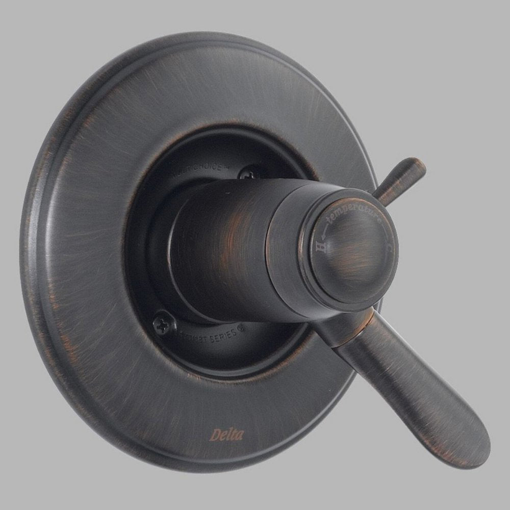Brushed bronze shower valve trim with circular escutcheon plate and single lever handle.