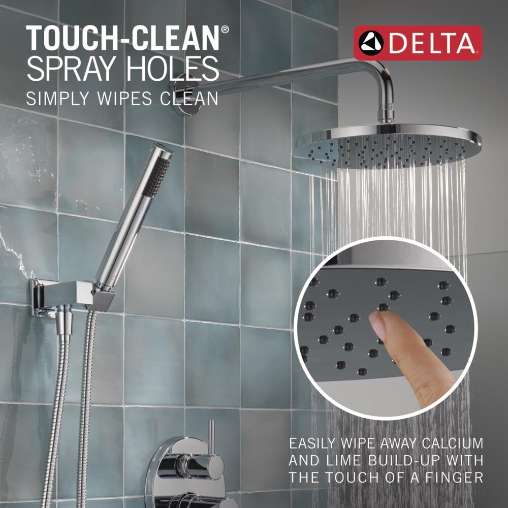 Chrome Delta shower system with round raincan head, handheld shower wand, and wall-mounted valve on tiled bathroom wall.